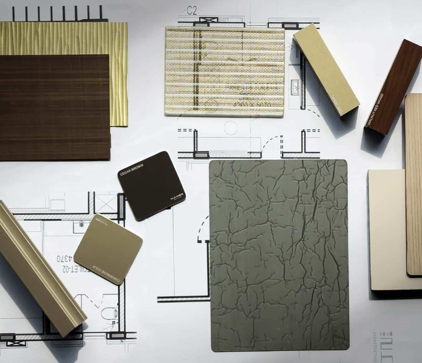 Material samples and drawings on the studio table