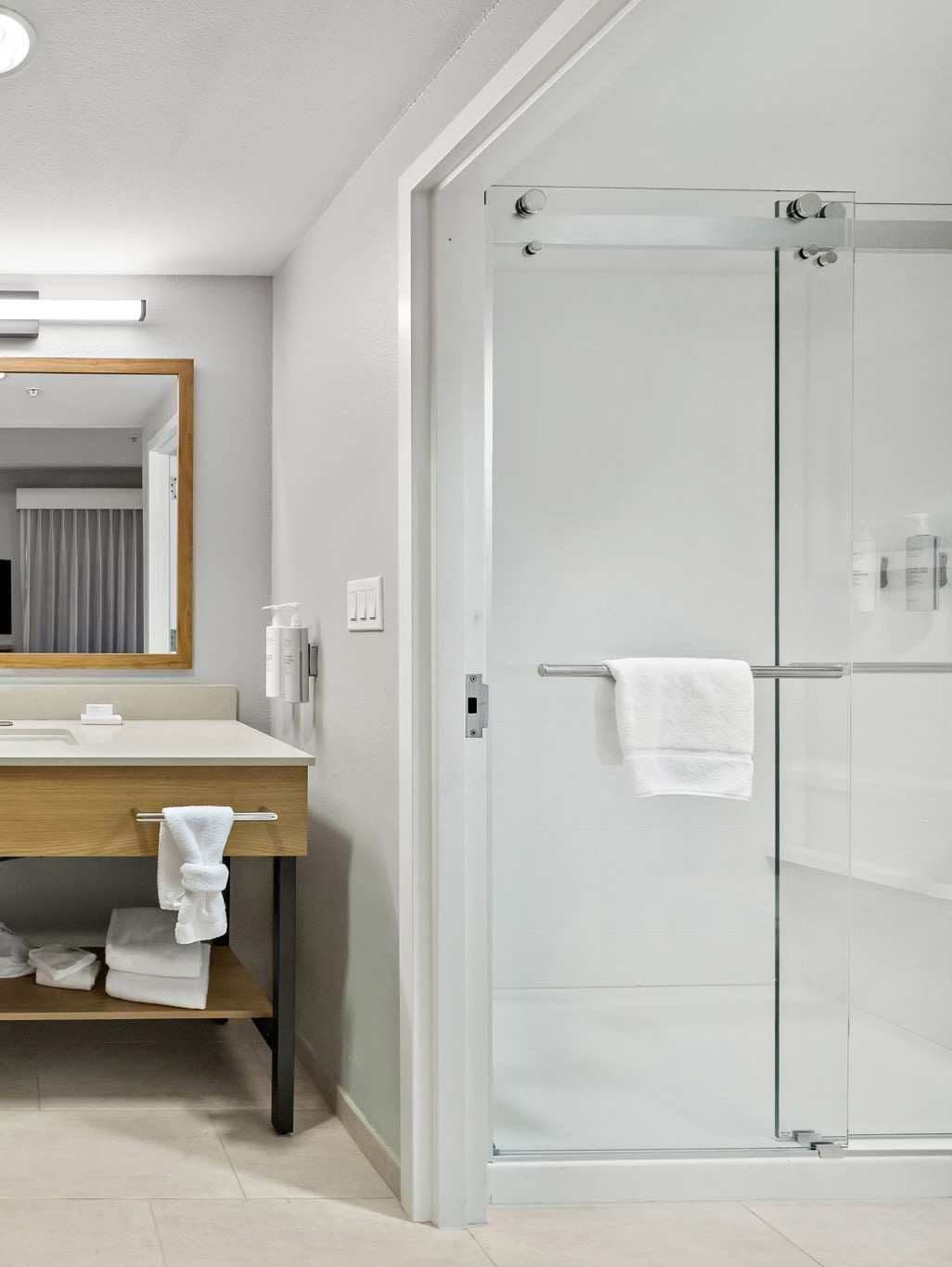 Hotel bathroom with a double bypass sliding shower enclosure, United States